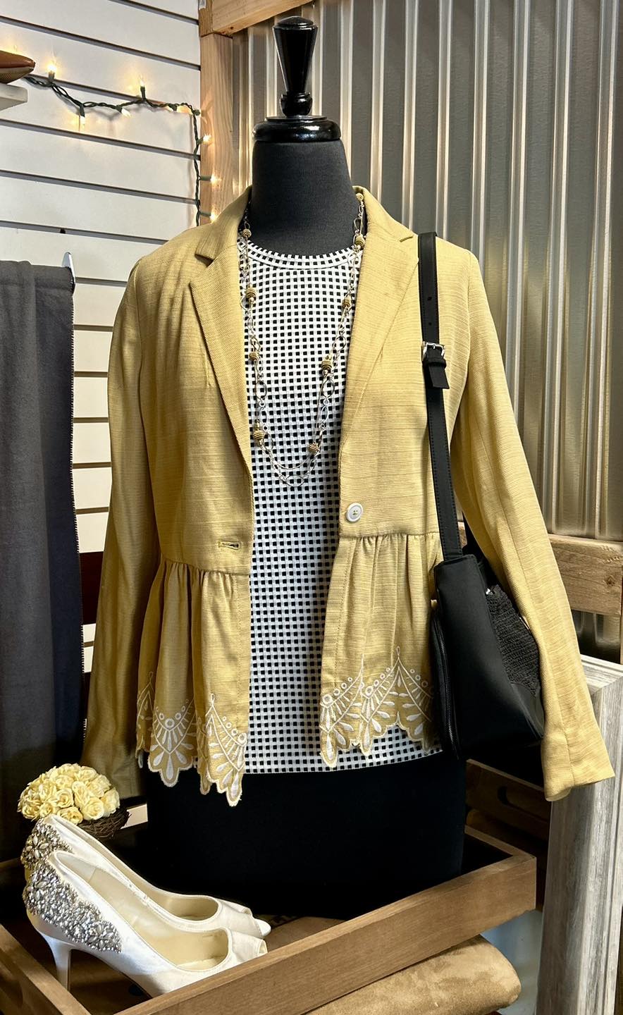 Mannequin in thrift store wearing amazing outfit