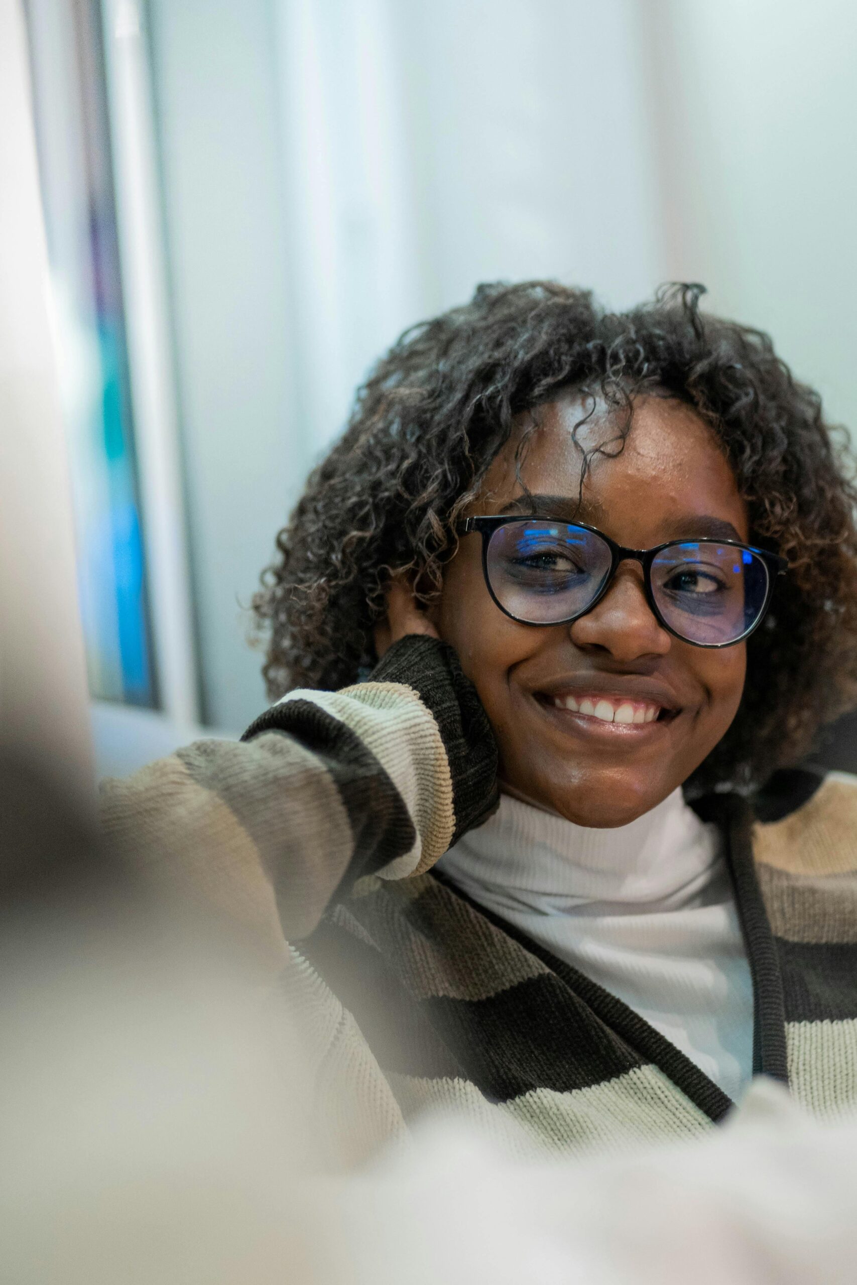 African American woman smiling with glasses
